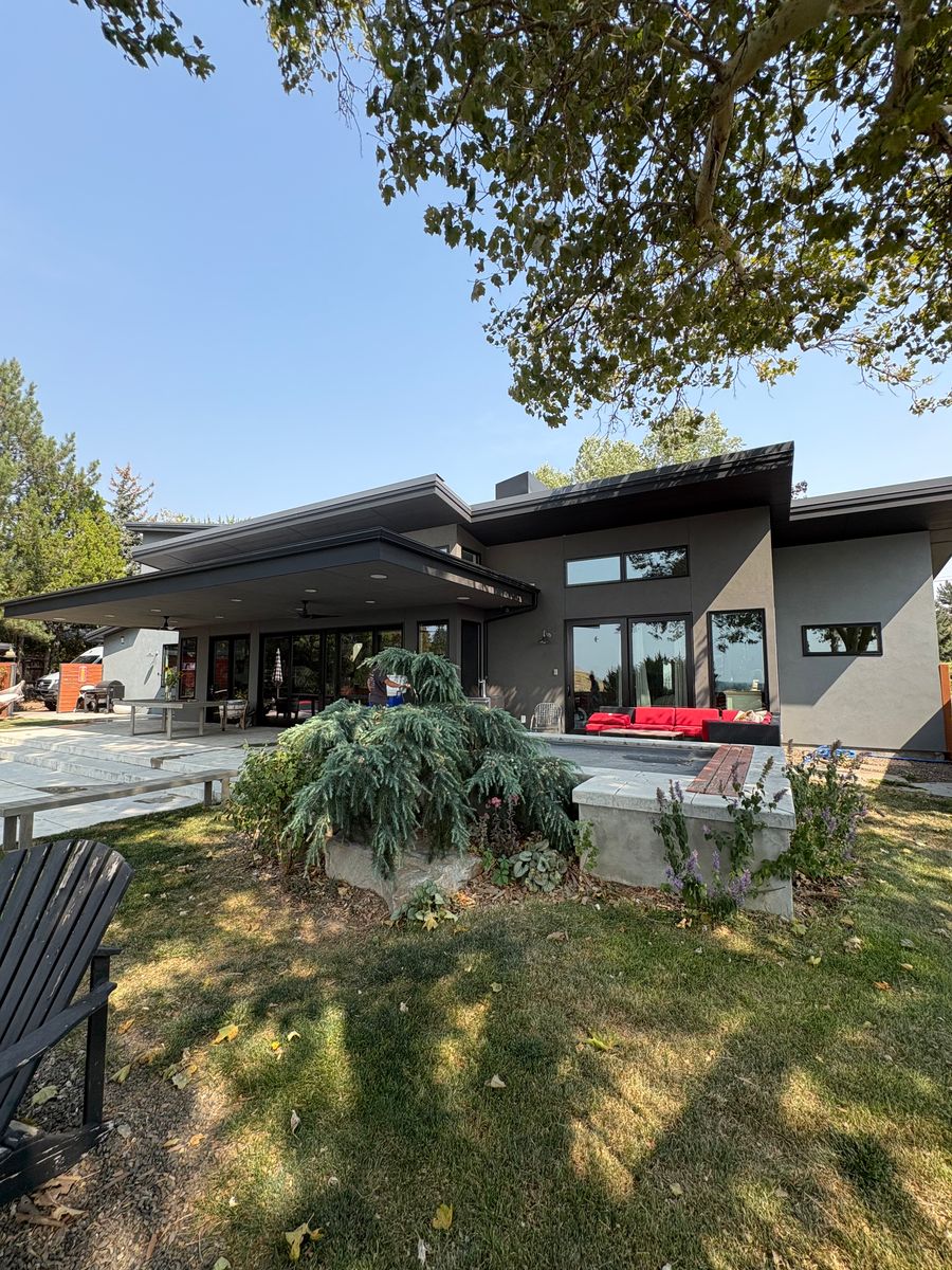 A modern single-story Boise home seen from the back lawn