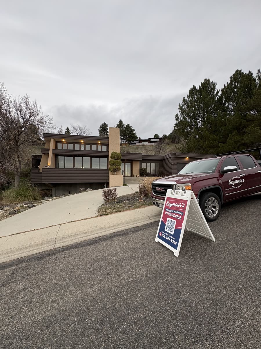 The Seymour's truck and sidewalk sign outside a hillside Boise home
