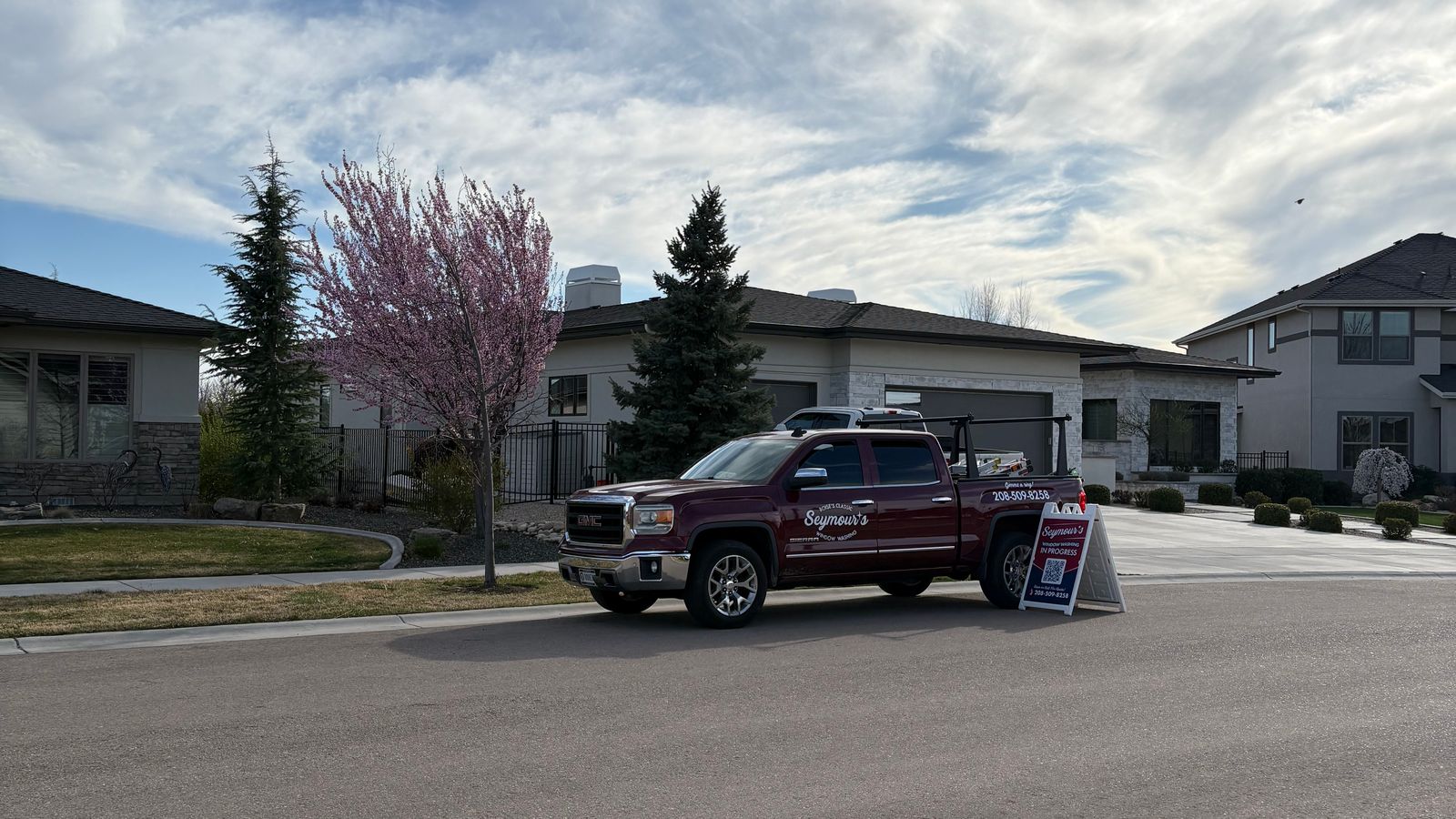The Seymour's truck and sidewalk sign on a residential street in Star